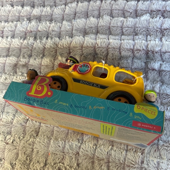 B. Boogie Bus Yellow School Bus
Toy with Lights, Sounds